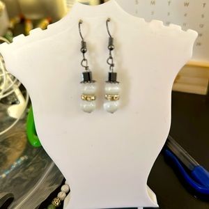 Handcrafted snowman earrings. Made with white cat eye opals.
